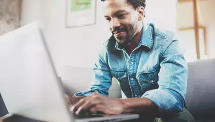 Man typing on laptop