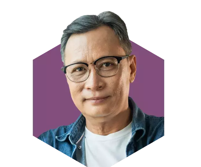 An Asian man smiling