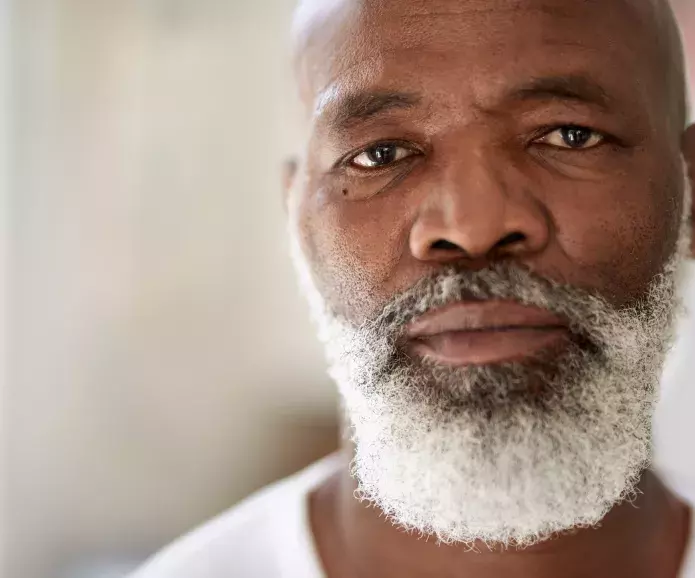 Black senior man looking straight ahead