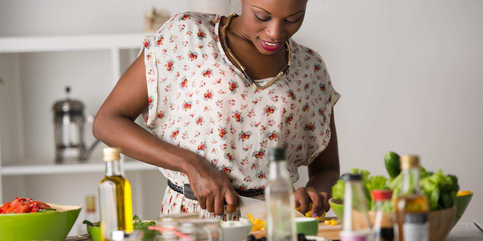 Young  woman cooking healthy food