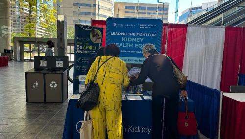 Guests visiting AKF exhibit booth