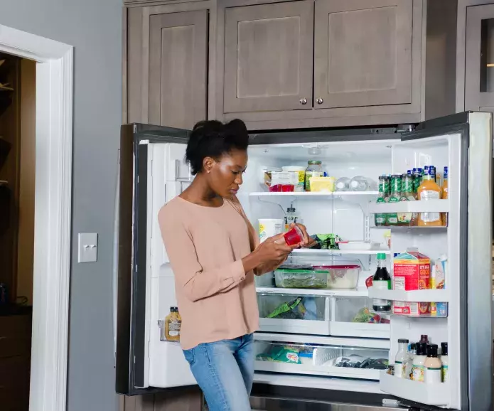 black woman reads food label akfsoot