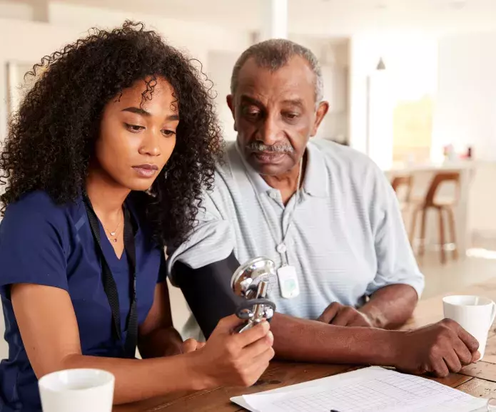 An older African American man getting a blood pressure test