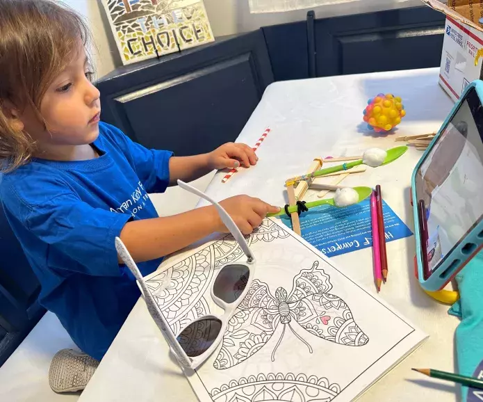 Cam Connections Child watching a tablet