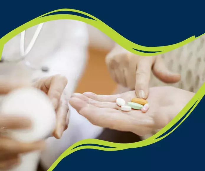 Hands counting pills