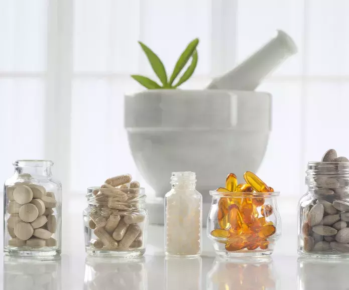 alternative medicine pills in bowls