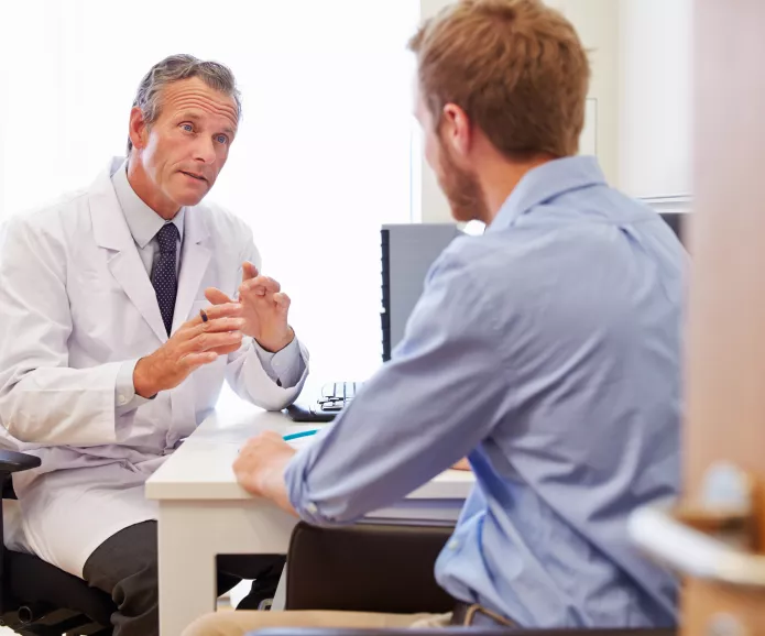 white male doctor explaining to patient