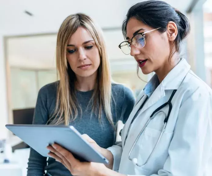 Doctor showing results on ipad