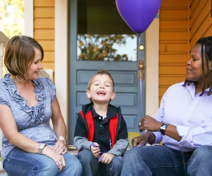 Gay couple celebrating young child's birthday