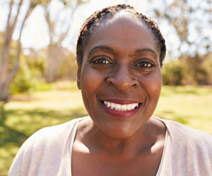 Smiling black lady outdoors