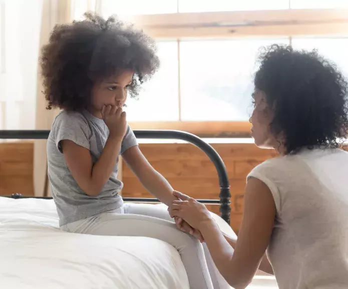 Sad child with mother