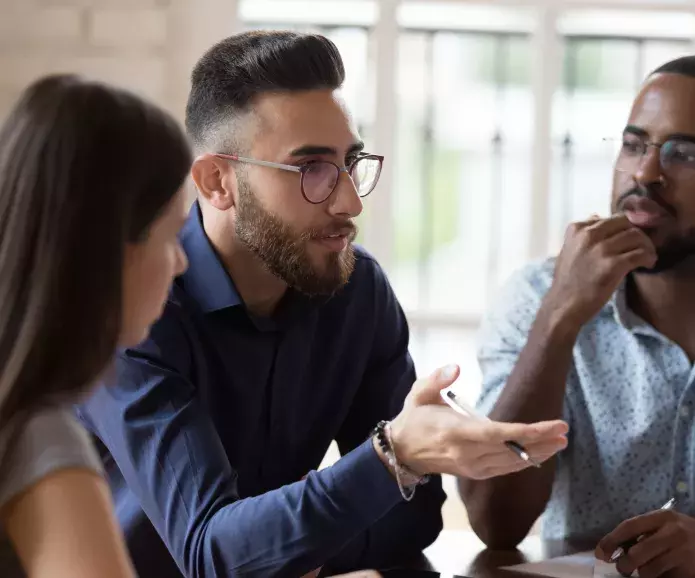 Group of three people talking