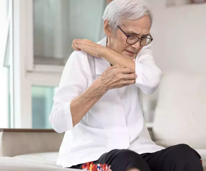 person looking unhappily at a rash