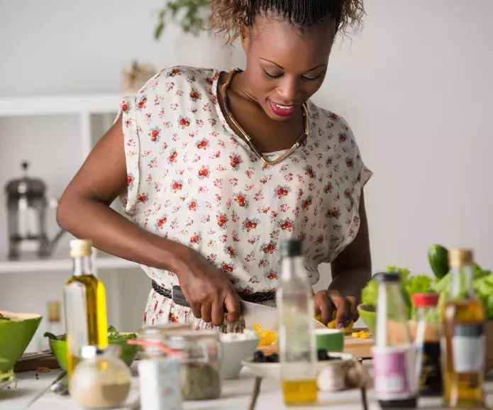 Young woman cooking healthy food