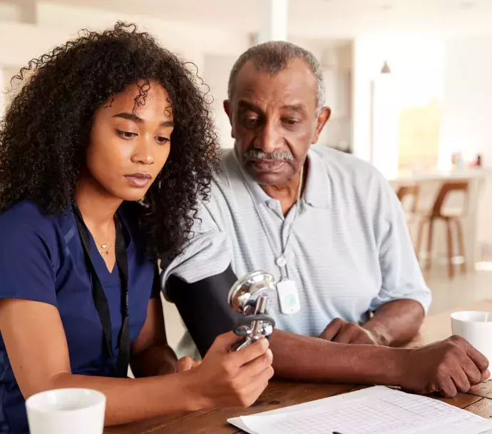 An older African American man getting a blood pressure test