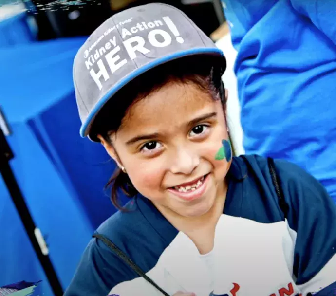 young boy wearing a hat.