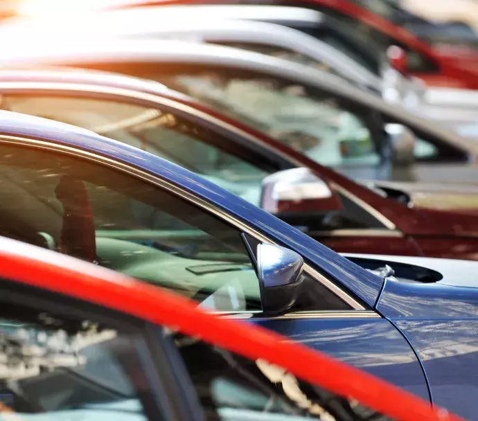 Multiple cars parked in a lot