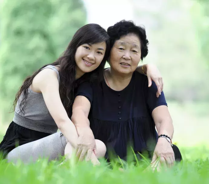 asian grandaughter embracing grandma asian grandaughter embracing grandma