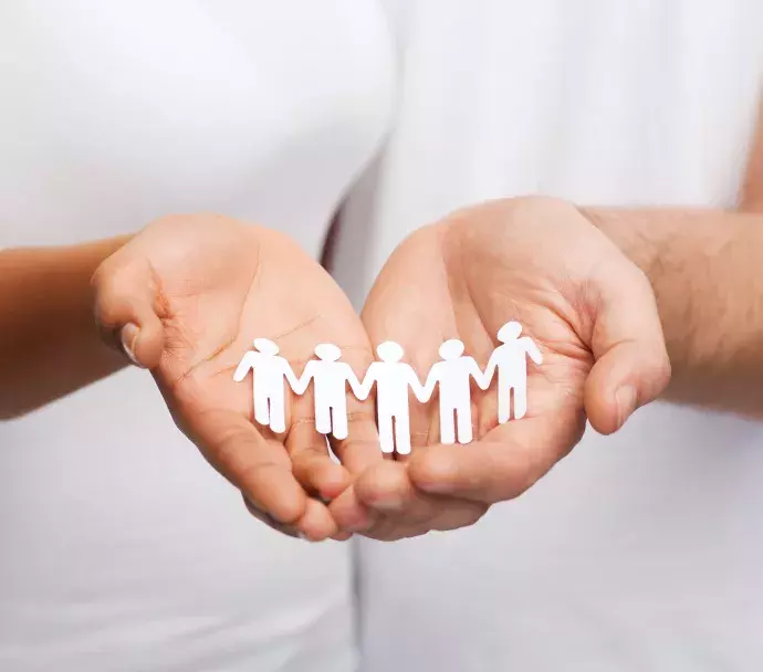 hands holding people cutouts