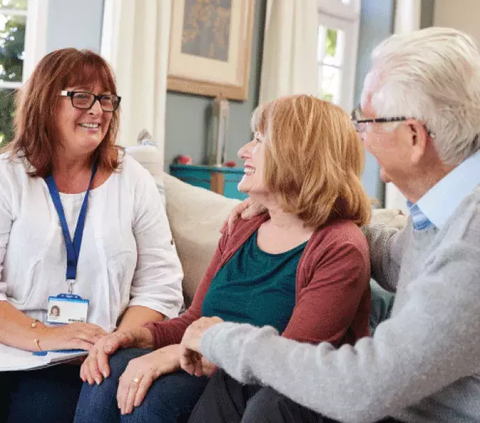 social worker talking with older couple