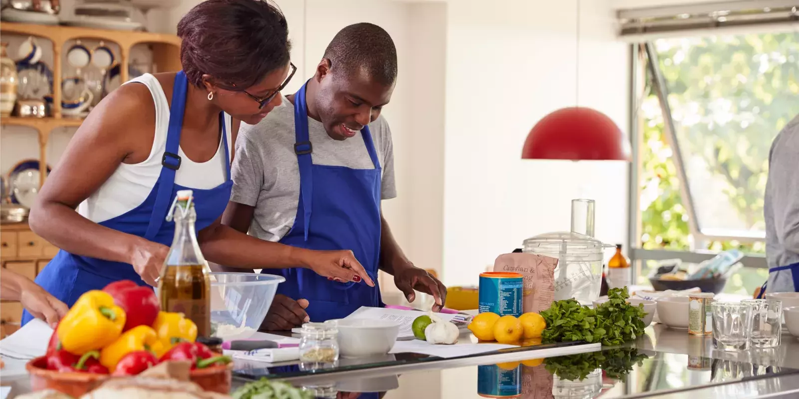 black pair at cooking class blue aprons