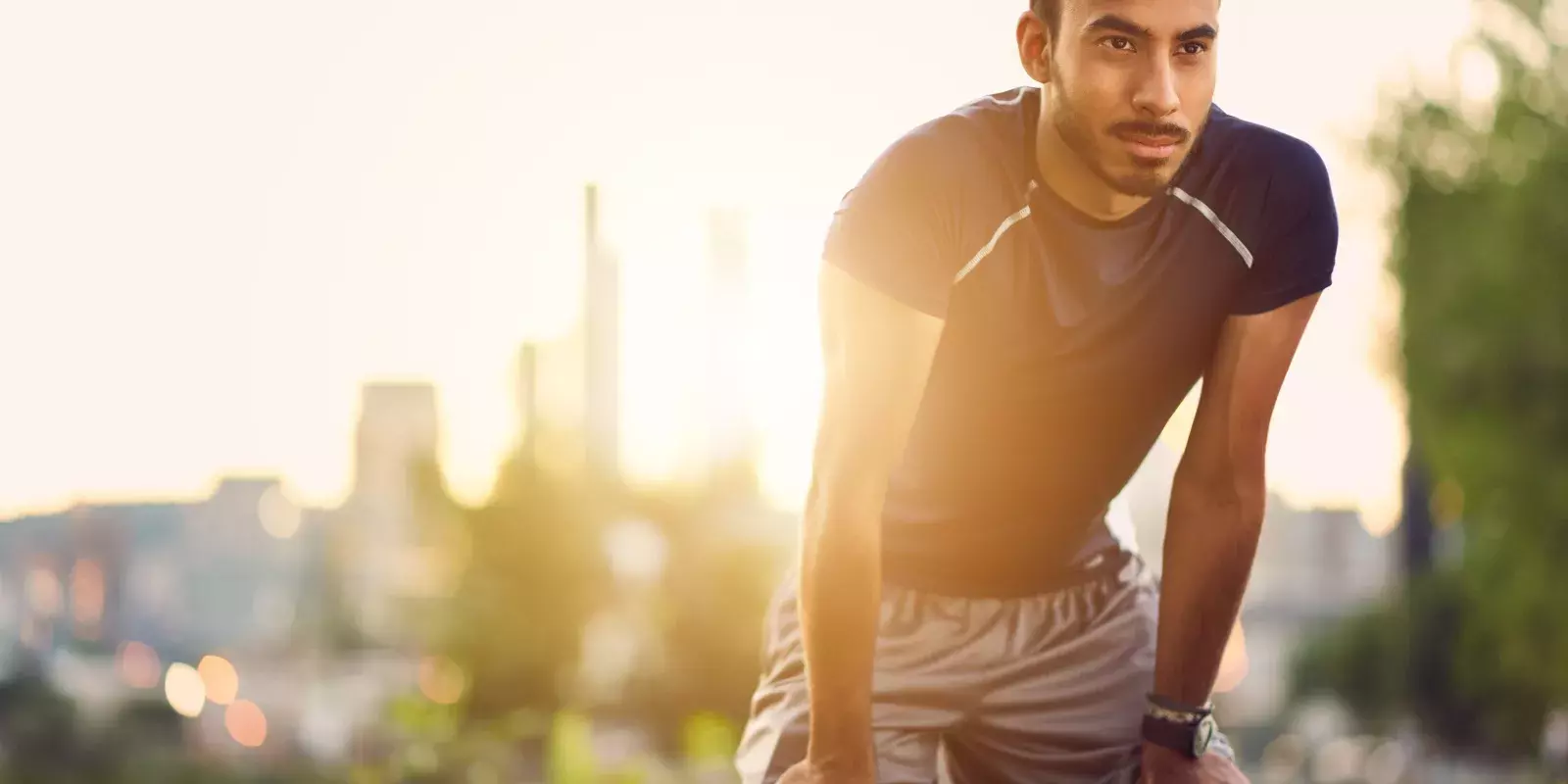 man preparing to run