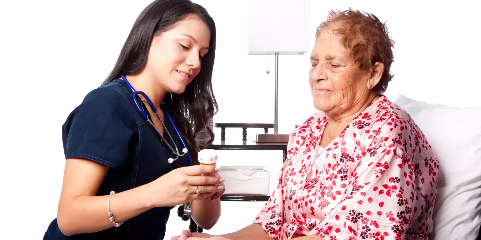 nurse explaining pills patient