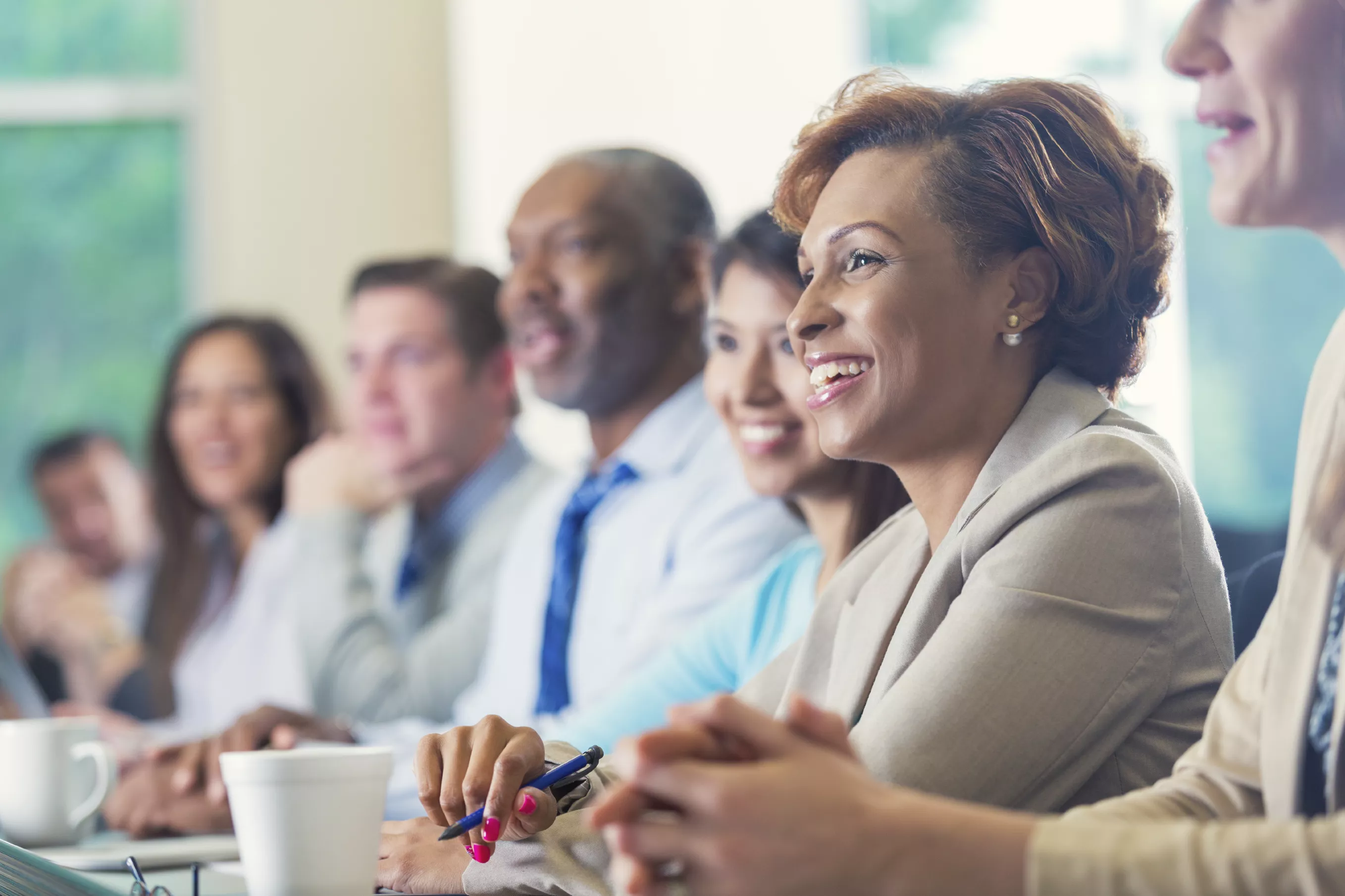Copy of business meeting listening smiling Copy of business meeting listening smiling